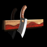 ember-red wall-mounted magnetic knife strip holding a kitchen knife