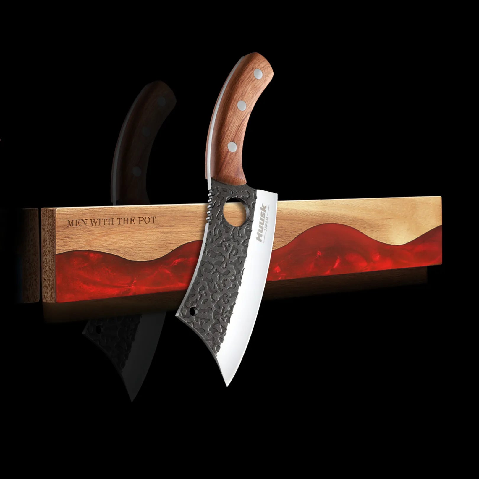 ember-red wall-mounted magnetic knife strip holding a kitchen knife