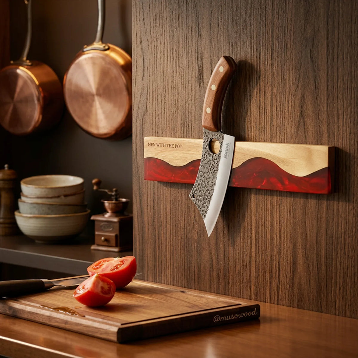 ember-red magnetic knife strip mounted in a kitchen with a knife attached