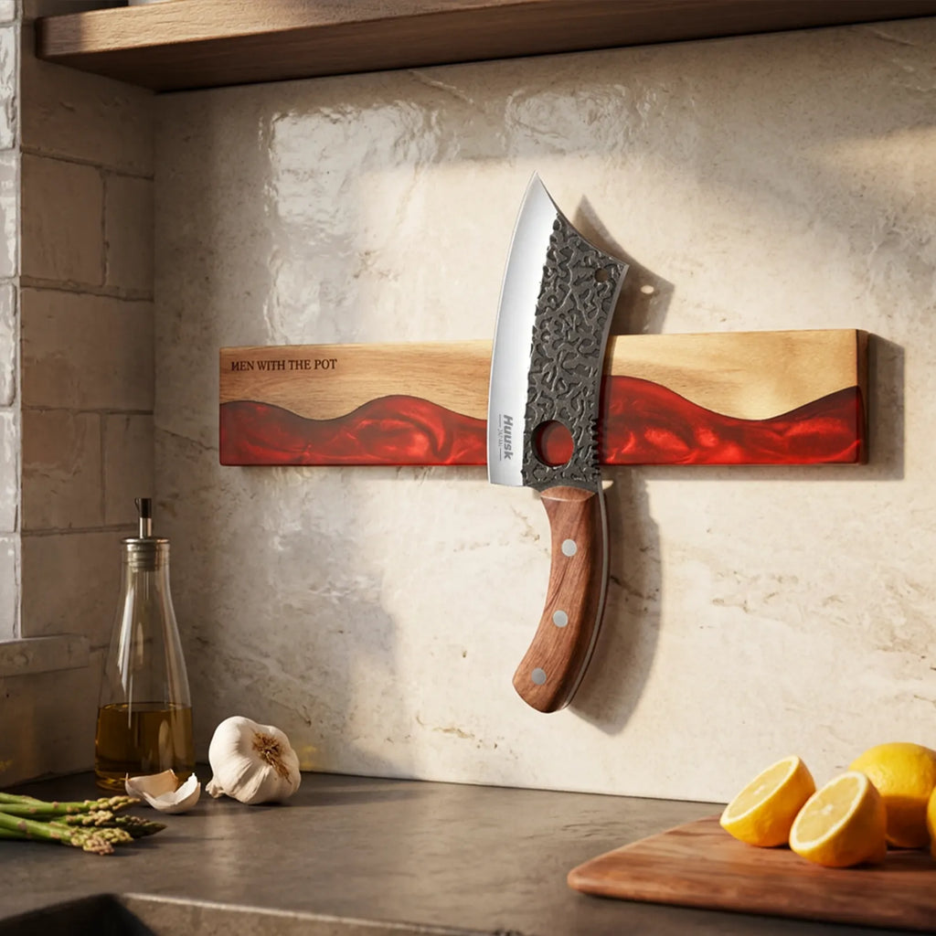 ember-red wall-mounted magnetic knife strip in a home kitchen
