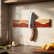ember-red wall-mounted magnetic knife strip in a home kitchen