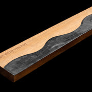 Close-up of the obsidian-black resin river detail in the acacia knife strip