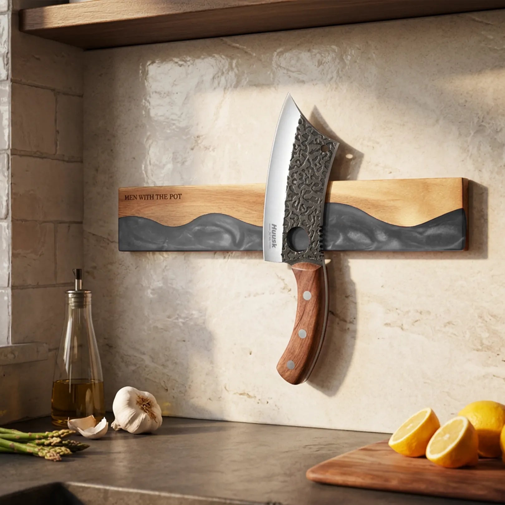 obsidian-black wall-mounted magnetic knife strip in a home kitchen