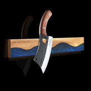 ocean-blue wall-mounted magnetic knife strip holding a kitchen knife