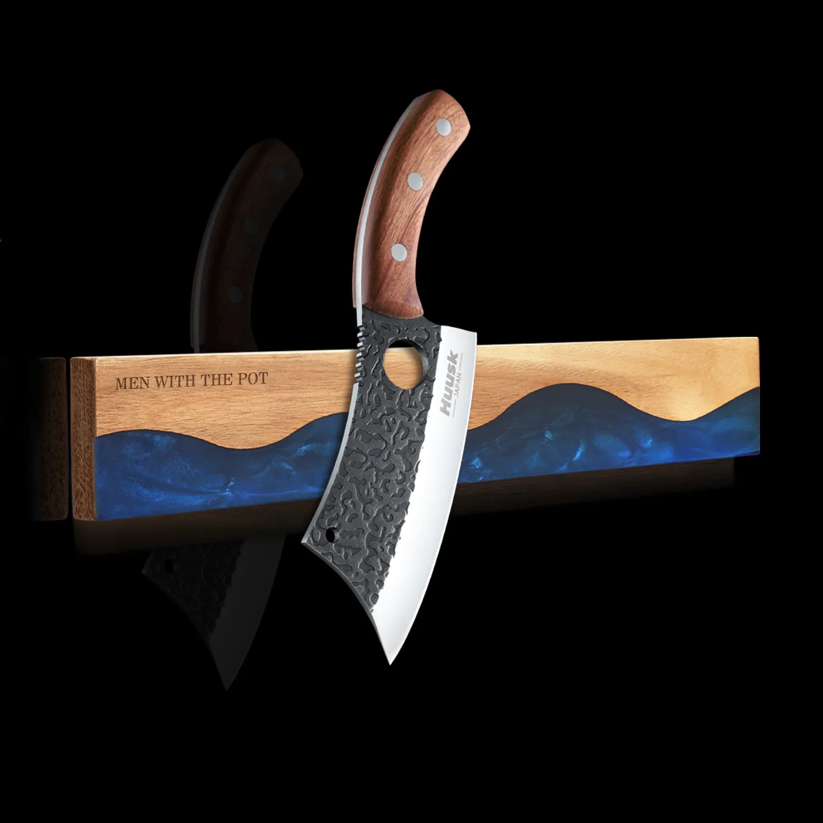 ocean-blue wall-mounted magnetic knife strip holding a kitchen knife