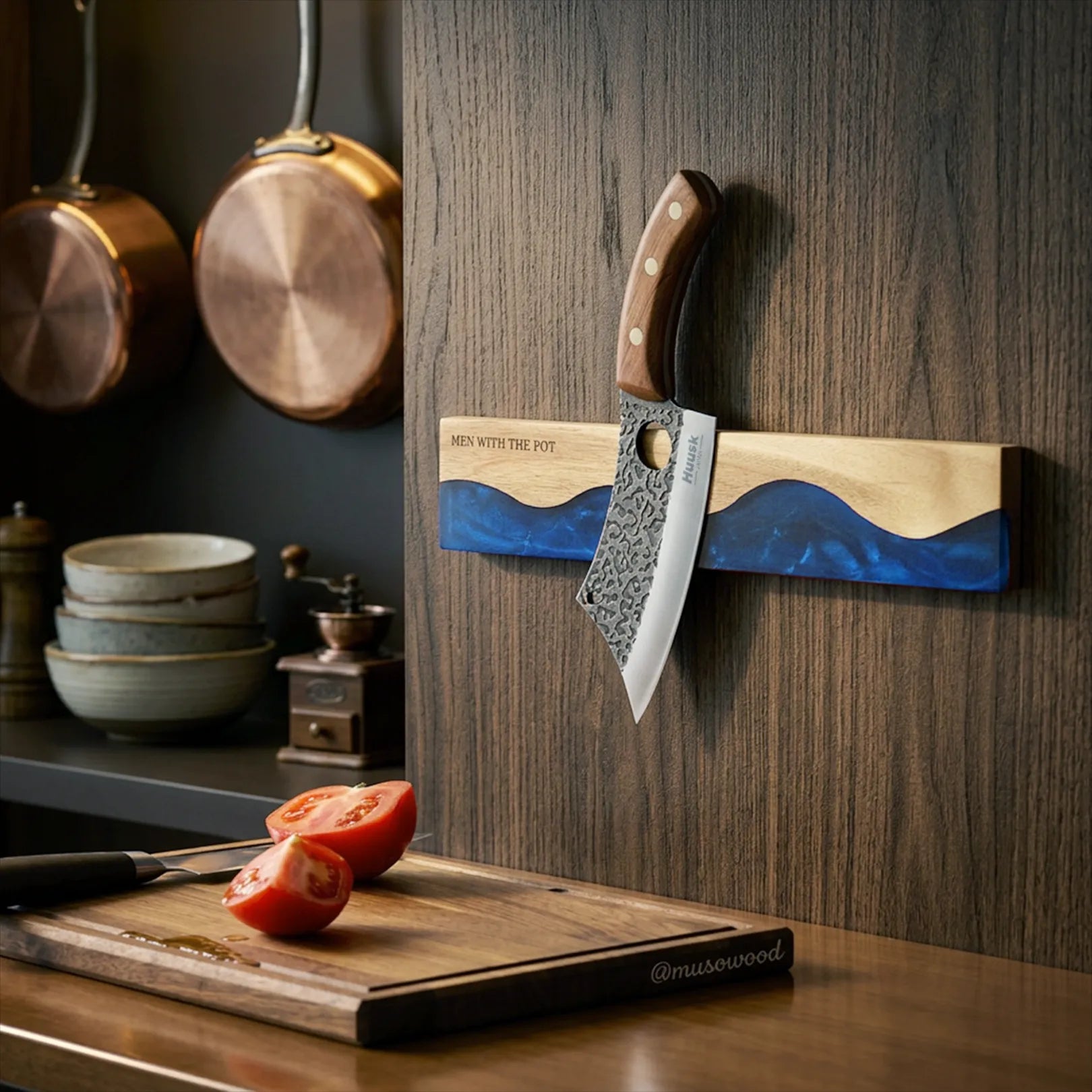 ocean-blue magnetic knife strip mounted in a kitchen with a knife attached