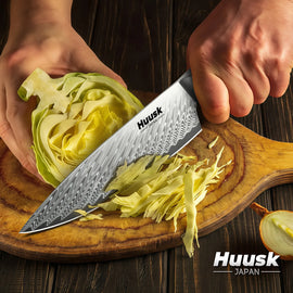 Damascus steel blade with distinctive wave pattern and mosaic handle design