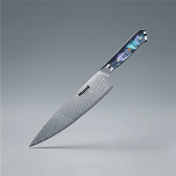 8-inch Damascus steel chef knife with blue resin handle and protective sheath