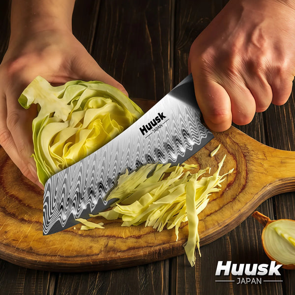 Santoku knife slicing vegetables on cutting board