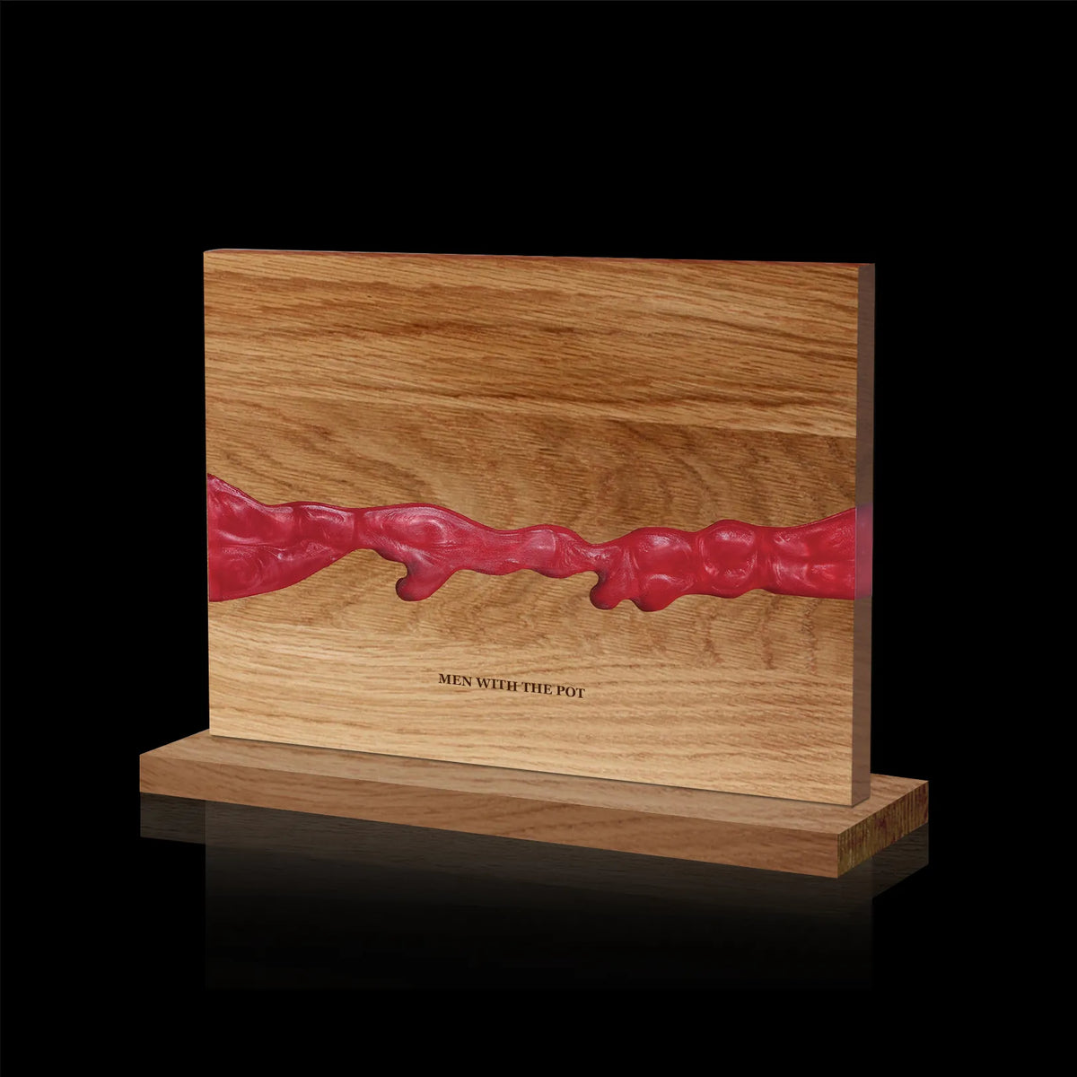 ember-red acacia and resin double-sided magnetic knife block on its countertop base