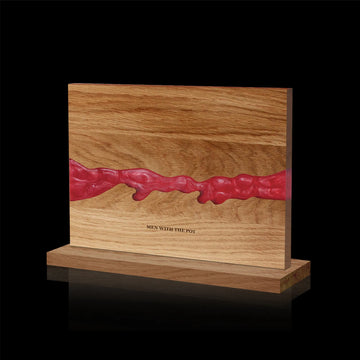 ember-red acacia and resin double-sided magnetic knife block on its countertop base