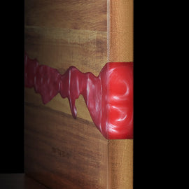 Close-up of the acacia grain and ember-red resin on the magnetic knife block
