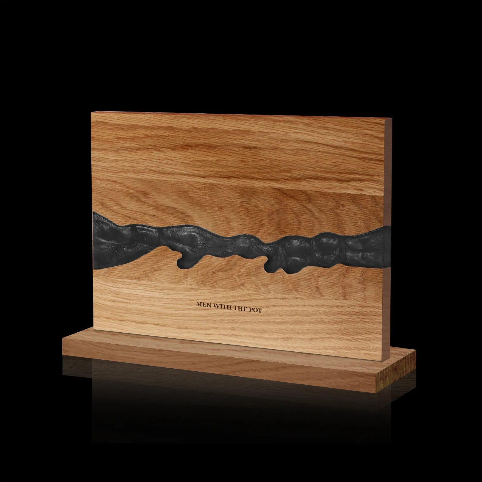 obsidian-black acacia and resin double-sided magnetic knife block on its countertop base