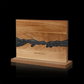 obsidian-black acacia and resin double-sided magnetic knife block on its countertop base