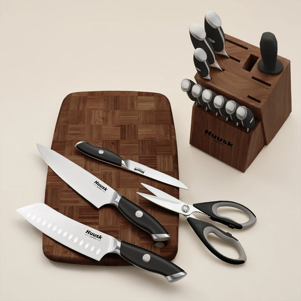 Huusk black kitchen knife set stored in an Acacia wood block on a countertop
