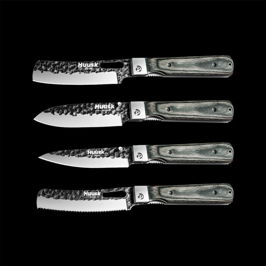 Four Huusk folding kitchen knives with dark camo handles and different blade shapes on black.