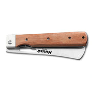 Huusk natural wood folding cleaver closed with the blade stored inside the handle.