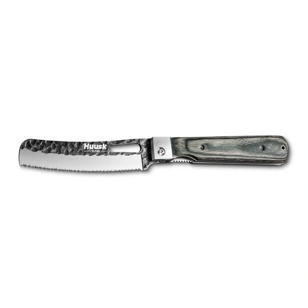 Huusk camo folding bread knife fully open in a side view on white.