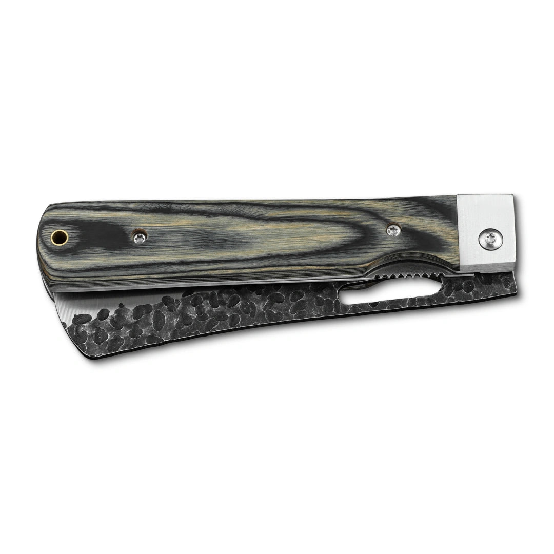 Huusk camo folding bread knife closed with the serrated blade stored in the handle.