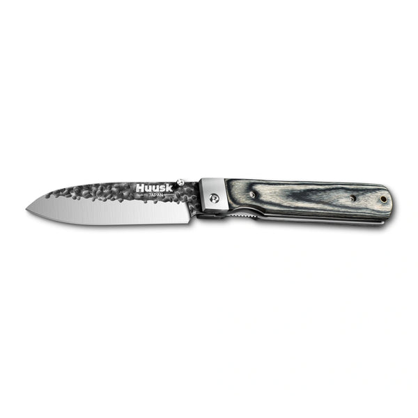 Huusk camo folding chef knife fully open in a side view on white.