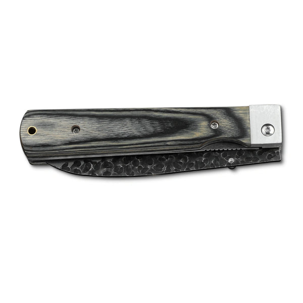 Huusk camo folding chef knife closed with the blade nested inside the handle.