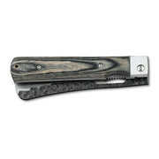 Huusk camo folding cleaver closed with the broad blade stored in the handle.