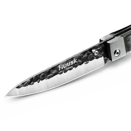Close-up of the Huusk camo folding paring knife blade and polished edge.