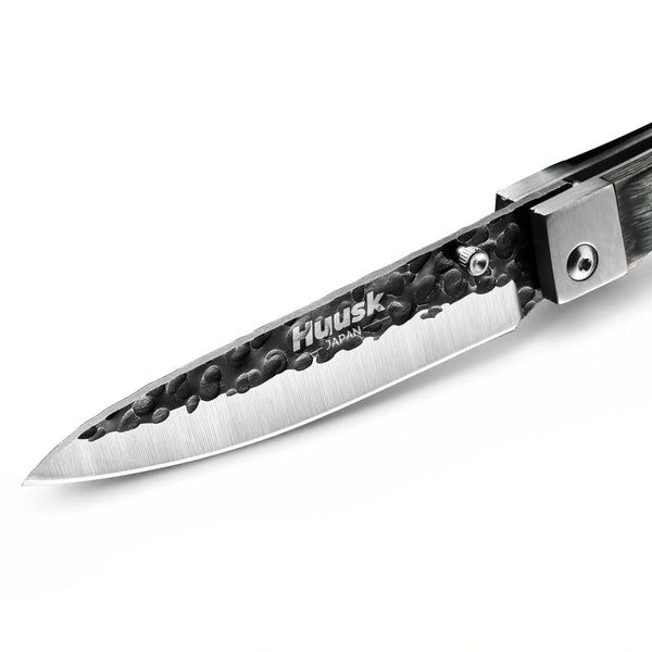 Close-up of the Huusk camo folding paring knife blade and polished edge.