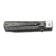 Huusk camo folding paring knife closed with the compact blade stored in the handle.