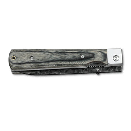 Huusk camo folding paring knife closed with the compact blade stored in the handle.