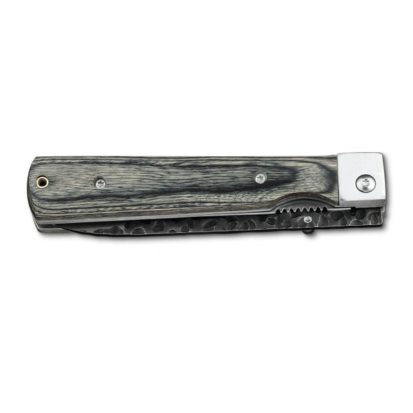 Huusk camo folding paring knife closed with the compact blade stored in the handle.