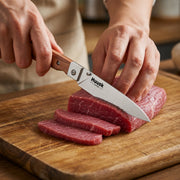 Huusk natural wood folding paring knife slicing beef on a kitchen cutting board.